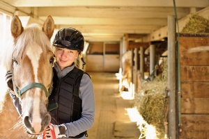 thumb_bigstock-Young-female-rider-with-horse--62073068